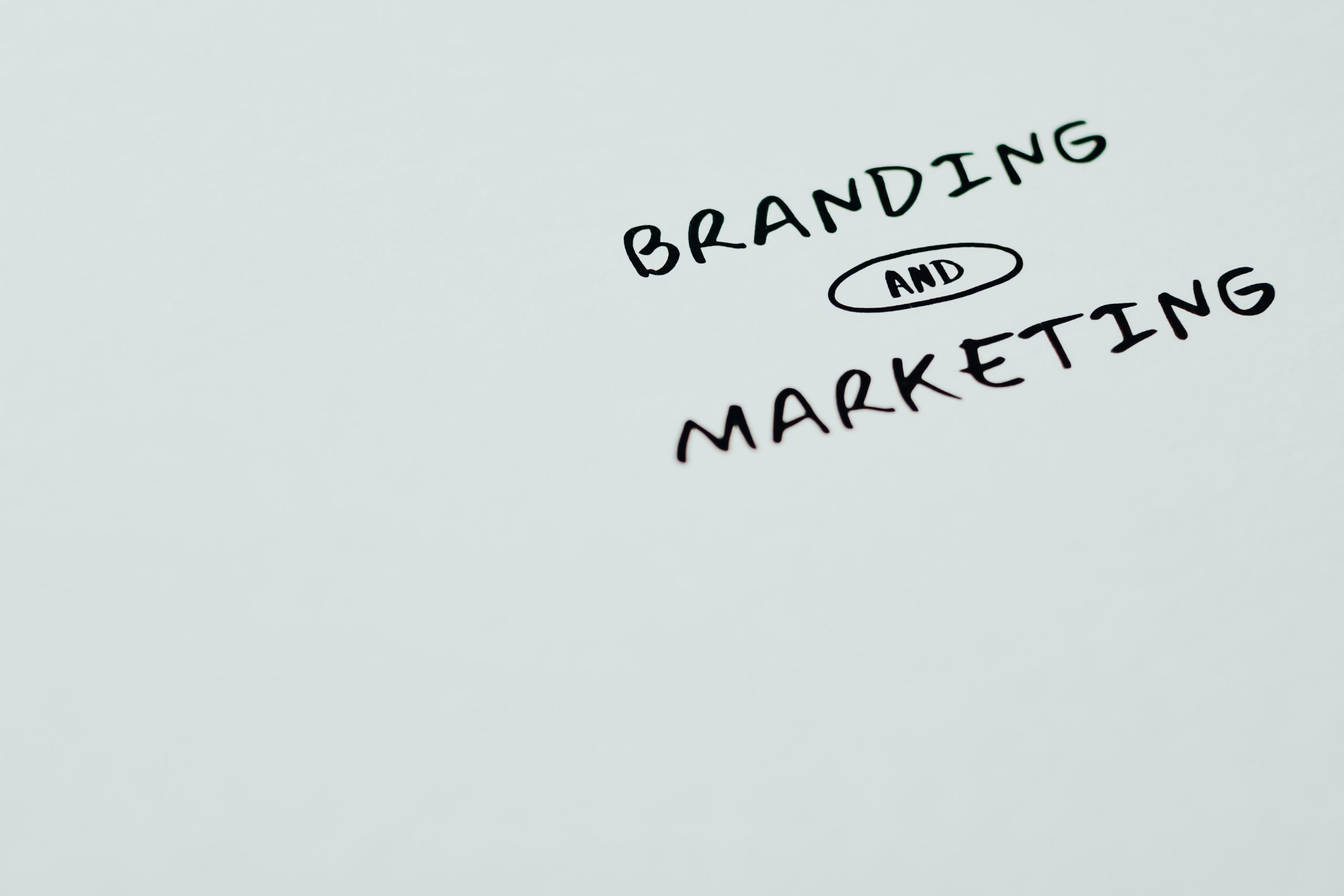 tablet with the words branding and marketing drawn